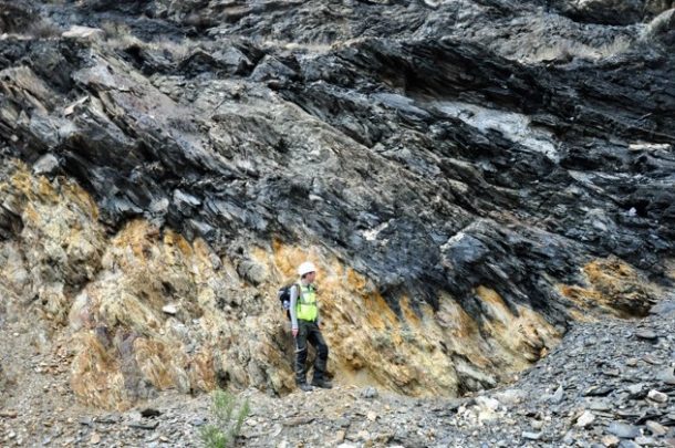 Man standing on rocky hillside